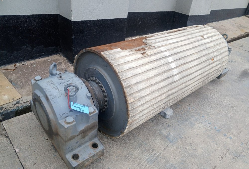 Failed ceramic pulley lagging before refurbishment