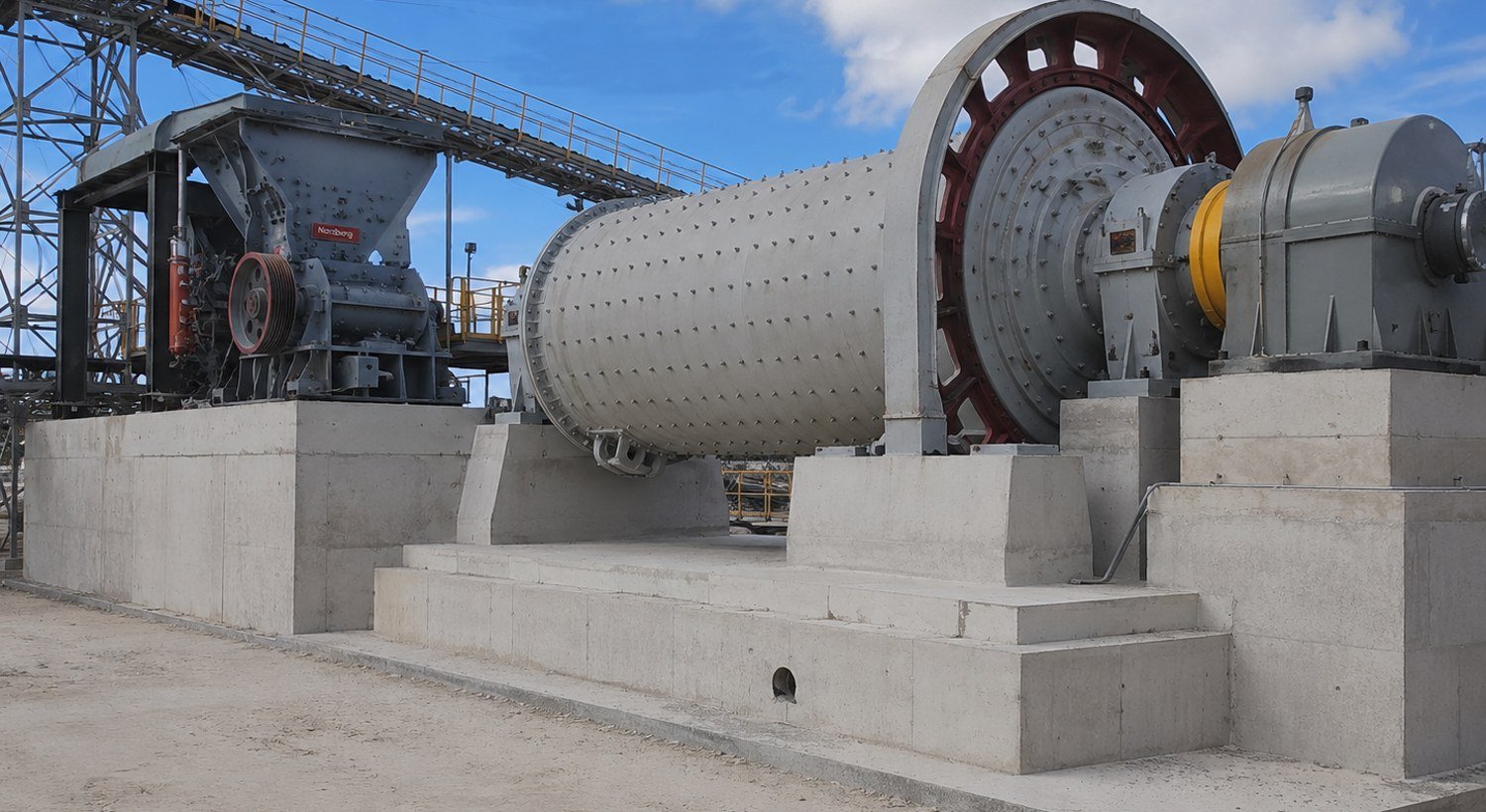 Crusher and ball mill on concrete foundations in a mining plant